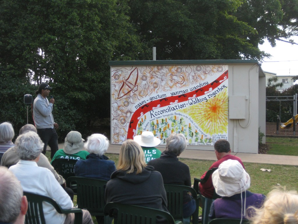 Lyndon Davis speaking at the opening of the reconcilliation mural